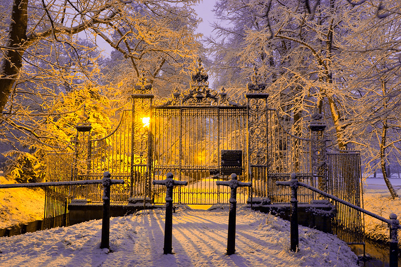 snow-covered gate leading into St. John's College at Cambridge University in England