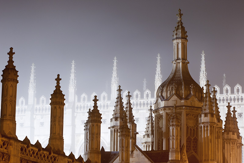 back-lit foggy spires from outside King's College at Cambridge University in England